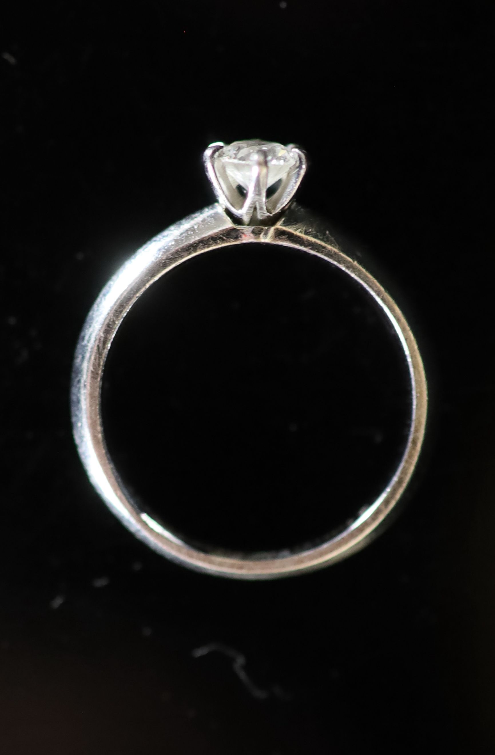 A modern Tiffany & Co platinum and round brilliant cut solitaire diamond ring